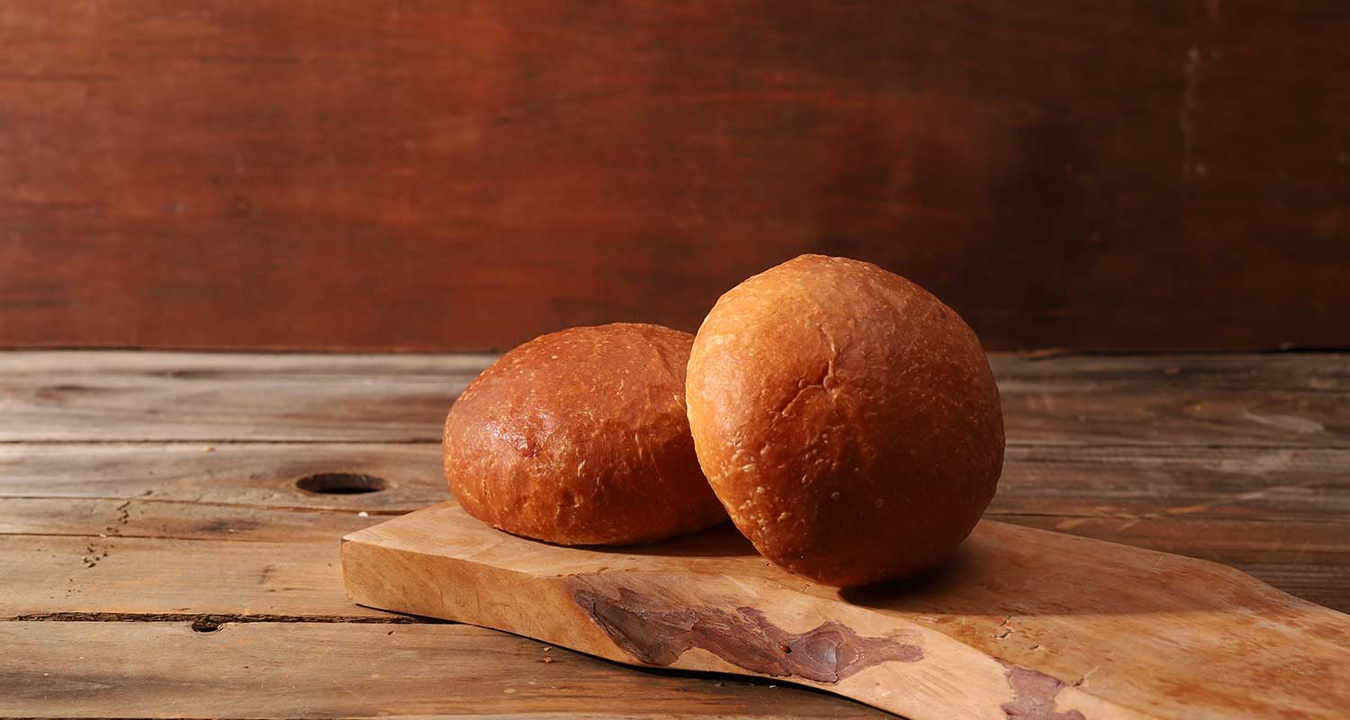 Side view of two brioche rolls
