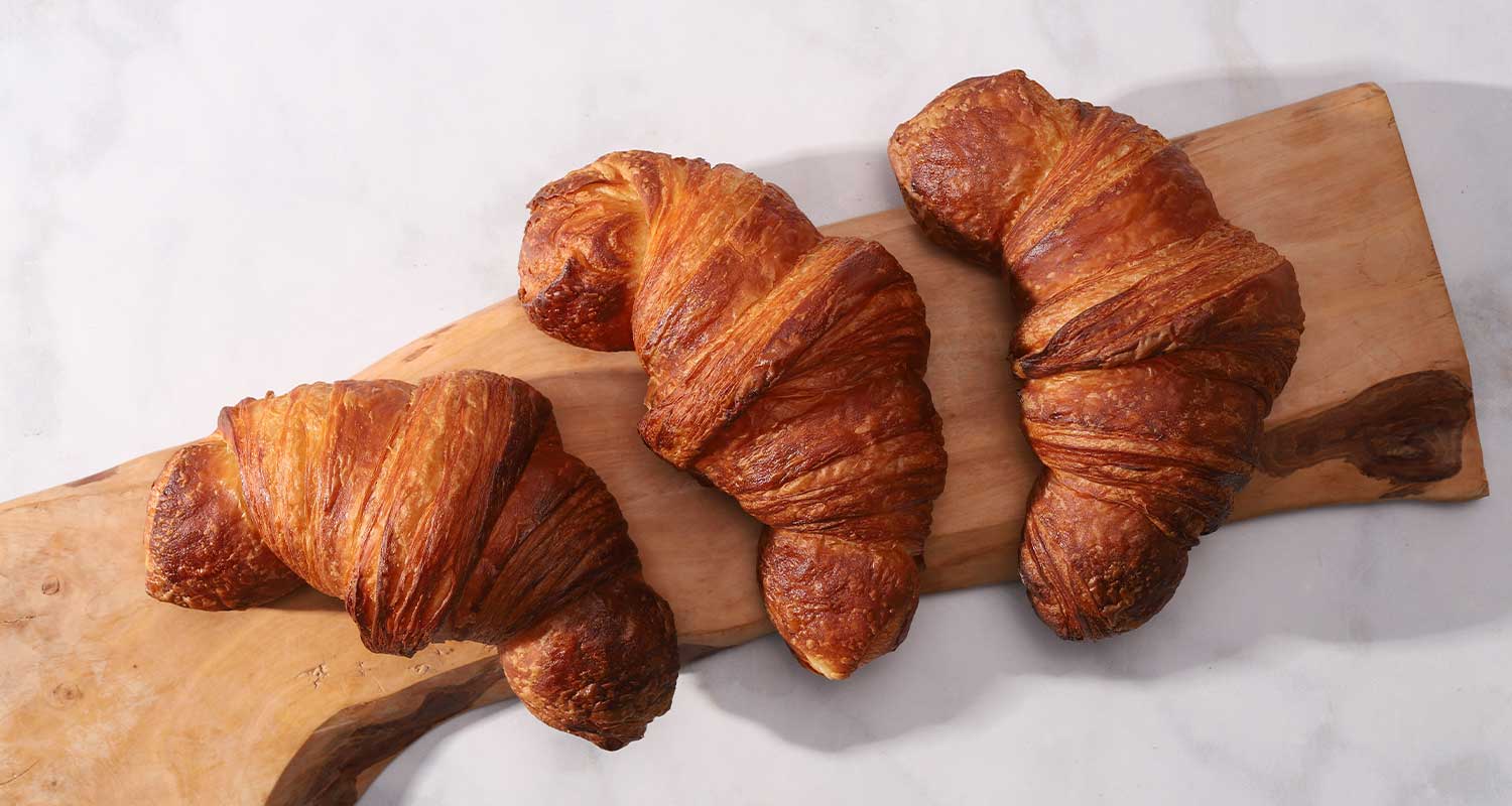Top view of three croissants from Standard Baking Co.