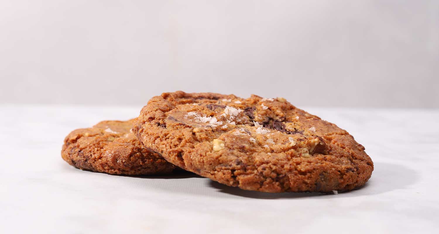 two sea salt chocolate pecan cookies from the side