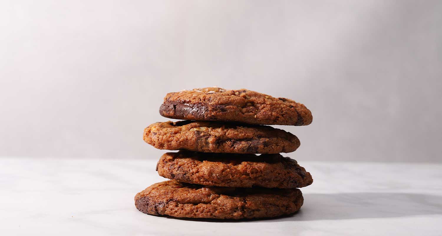small stack of sea salt chocolate pecan cookies